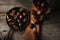 Flat Lay still life of a bucket of fresh chestnuts and a pan full of roasted nuts, with warm side light