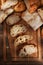 Flat Lay still life of fresh baked loaves of bread, with slices on a wood cutting board, with warm side light