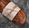 Flat Lay still life of a loaf of Multi-Grain Bread on Slate Background