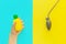 Flat lay stress, antistress: toy squish yellow pineapple in hand, blood pressure monitor.Bright blue background.Compressing, soft,