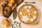 Flat lay tart with lemon, orange and ginger jam decorated with star-shaped cookies