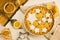 Flat lay tart with lemon, orange and ginger jam decorated with star-shaped cookies