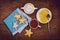 Flat lay tea, biscuits in the form of stars and lemon on wooden table
