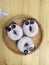 Flat lay of three panda donuts