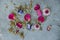 Flat lay top down view image of romantic vintage look of Spring and Summer flower petals and blooms still life on rustic old worn