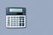 Flat lay or top view of calculator on viollet background paper with blank copy space, math, cost, tax or investment calculation.