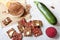 Flat lay top view crunchy flax seeds wooden spoon and crispbread with dry vegetables and raw round piece of beetroot and