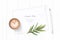 Flat lay top view elegant white composition paper botanic garden plant tarragon leaf tag pencil and coffee on wooden background