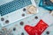 Flat lay or top view of laptop keyboard, gifts and red Santa Claus sock on fake snow. Online shopping for christmas holiday