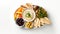 A flat lay Top view of a Mediterranean mezze platter, featuring olives, hummus, and pita bread.