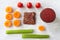 Flat lay top view square crunchy flax seeds crispbread with beet and raw round organic vegetables on white background