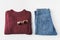 flat lay with trendy burgundy knitted sweater, jeans and sunglasses,