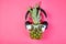 Flat lay of trendy, funny face pineapple fruit with headphones and sunglasses,