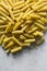 Flat lay of uncooked tortiglioni pasta shells