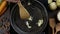 Flat lay video: chef stirs crushed garlic by wooden kitchen spatula on the hot pan, tabletop of cooking vegetarian food