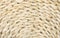 Flat lay view of corn husk braided texture pattern  light beige color.