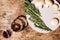 Flat lay view of glass with red wine and white plate with the minimalist vegan food - champignon mushrooms and rosemary branches