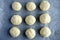Flat lay view of round pieces of Bread Rolls dough