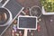 flat lay view wooden signage,vintage camera, compass and artificial plant on wooden background