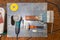 Flat lay view of a workbench with a set of tools consisting of a large heavy vise, angle grinder, screwdriver, cutter,