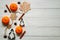 Flat lay. White rustic table with tangerines, cinnamon sticks, anise-star, Christmas molds for pastry,wooden snowflakes.