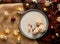 Flat lay of yummy mince pies served on a plate, surrounded with bright Christmas decorations