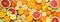 Flat layout banner completely filled with many different fresh, fruity and colorful citrus fruits