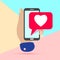 flat minimal hand holding mobile phone ith pink heart like social media icon with shadow on pastel colored blue and pink