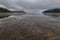 Flat open beach with sand and no people with distance cloud, looks relaxing place on Vancouver Island, British Columbia, Canada