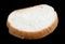 Flat piece of white wheat bread lie on table  isolated on black macro