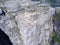 Flat rock Preikestolen over fjord Lysefjorden is natural attraction. Top view and flight down above cliff. Preacher`s Pulpit or P