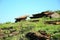 Flat sacrificial stones on a pedestal facing each other at an angle at the top of the mountain