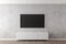 Flat smart tv panel on concrete wall with white sideboard and brown wooden floor - entertainment, media or home television set