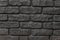 flat surface, texture of black torn brick with uneven masonry1