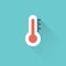 Flat thermometer icon on blue background