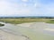 Flat tidal bay and pasture near mont saint-michel