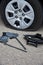 Flat tire of a car, wheel replacement tools, trouble on the road