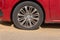 Flat tire of a red Peugeot 208 car