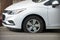 Flat Tire on a White Sedan Parked Along a City Street