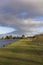 The Flat toped and grassy embankment that divides the 2 Reservoirs at Monikie Country Park