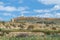 Flat topped plateau hill in the rural village of Ghasri, Gozo, Malta, with the Ta Giordan lighthou