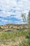 Flat topped plateau hill in the rural village of Ghasri, Gozo, Malta, with the Ta Giordan lighthou