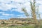 Flat topped plateau hill in the rural village of Ghasri, Gozo, Malta, with the Ta Giordan lighthouse