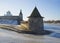 Flat Tower on the river Pskov february day. Russia
