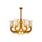 Flat vector icon of antique golden chandelier. Decorative hanging light with four branches for light bulbs