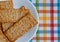 Flatbread salted multigrain crackers on a white plate