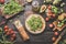 Flatbread wrap sandwich with ingredients and utensils at wooden kitchen table. Tomatoes, avocado, arugula, cucumber, oil and