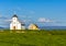 Flateyjarkirkja white lutheran church and couple of living huts