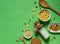 Flatlay with a bottle of rice milk, corn flakes and dried fruit on a bright green background with space