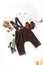 Flatlay children`s clothing, children`s brown shoes, Shoes for autumn, brown trousers and white shirt
